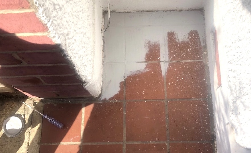 A new porch on a budget - first paint the tiles